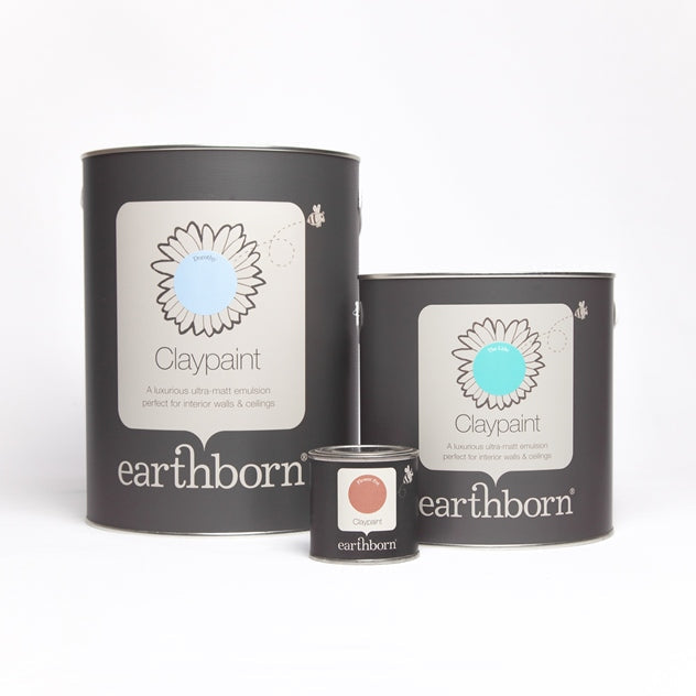 Two cans of earthborn Claypaint on a white background