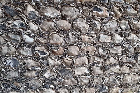 close up of grey flint gallets bedded around grey flint stones