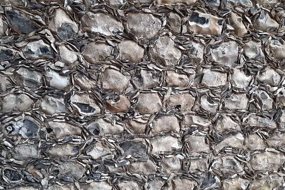 close up of grey flint gallets bedded around grey flint stones