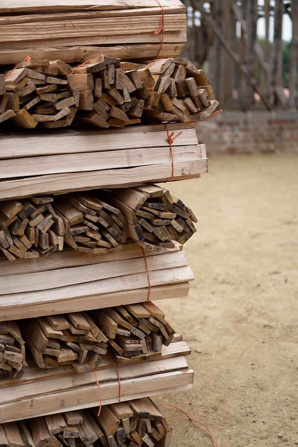 stacked bundles of hand riven chestnut laths
