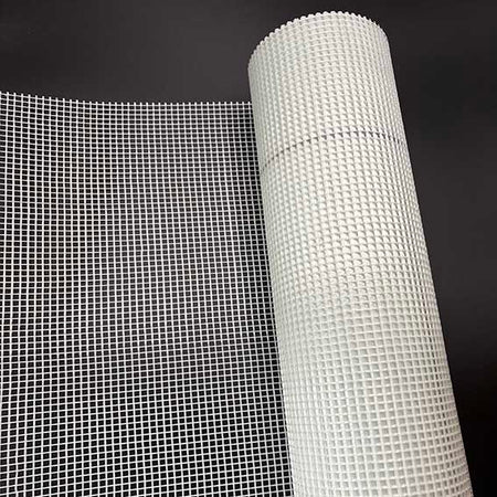 roll of render mesh on a black background