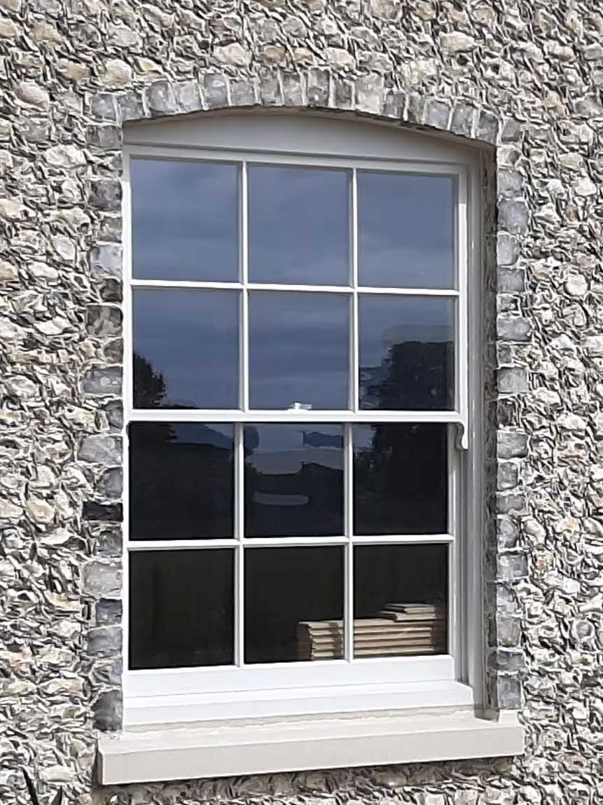 period window frame with hand knapped flint square surround