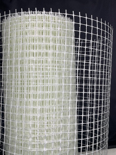 roll of render mesh on a black background