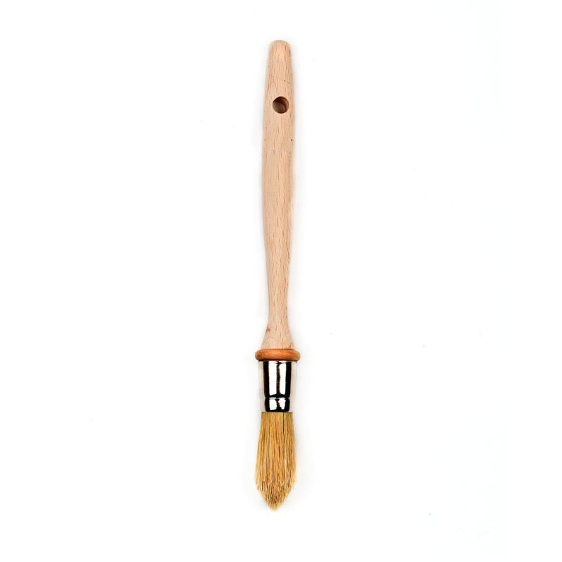 Chef's brush with wooden handle and bristle head on a white background