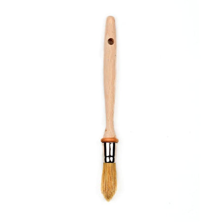 Chef's brush with wooden handle and bristle head on a white background