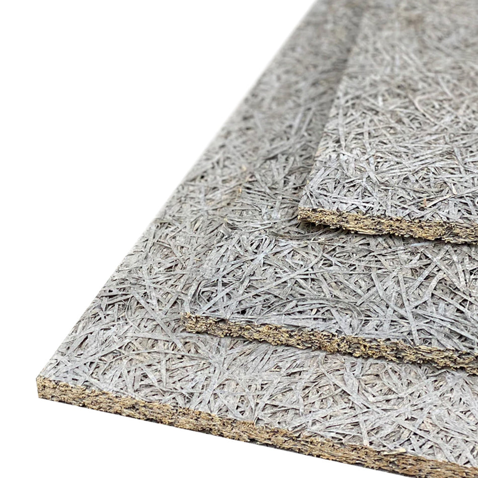 Stack of grey wood wool boards showing the texture and thickness of the material.