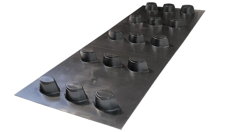 A black SureCav cavity spacer backing board with multiple spacer protrusions designed for creating a consistent 50mm clear cavity behind the outer masonry leaf.