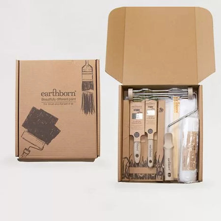 Earthborn paint kit with paint roller, bottles, and tools inside a cardboard box on a white background