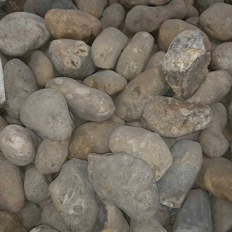 close up of smooth cobbles in a bulk bag