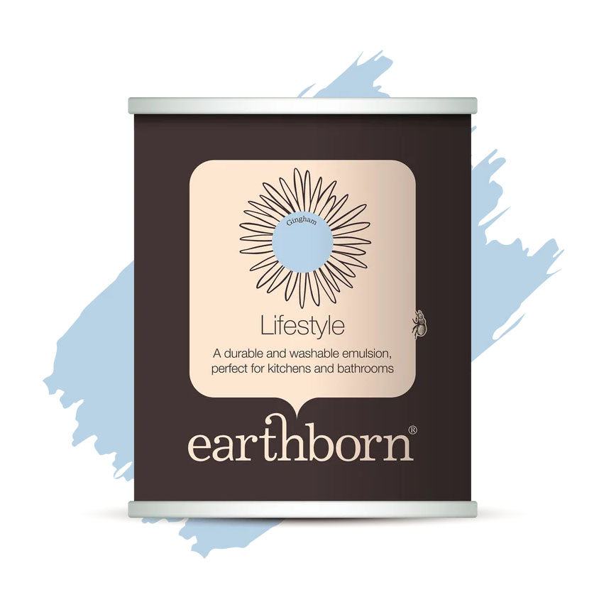 A single can of earthborn Lifestyle kitchen and bathroom emulsion shown on a white background with a light blue paint-splatter graphic behind it. The can is dark brown with a beige label and silver metal rims at the top and bottom.