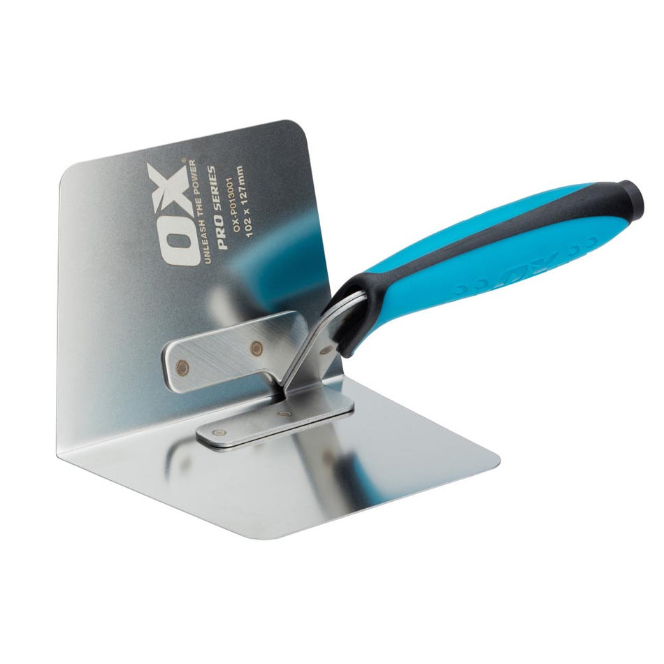 Metal trowel with blue handle on a white background, featuring OX Tools branding.