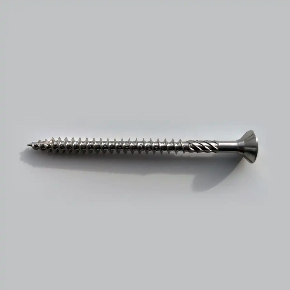Metal screw on a light gray background